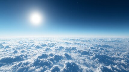 Wall Mural - a clear sky above thin clouds, deep blue with a tiny bright sun on the horizon
