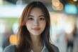 © Visual Odyssey - Portrait of beautiful young asian business woman is working in modern city, Generative AI