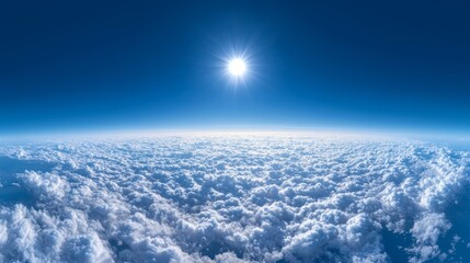 Wall Mural - a panoramic view above the clouds, deep blue sky