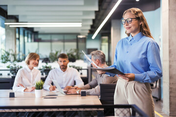 Wall Mural - Face of beautiful woman on the background of business people.