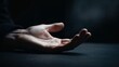 © Shadaw - close-up, dark, and moody photograph focusing on a human hand