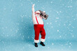 © deagreez - Full length body size view of his he nice cool stylish cheerful Santa big belly pants carrying vintage cassette player dancing isolated on bright vivid shine vibrant blue turquoise color background