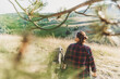 © olezzo - Young happy relaxed woman enjoying view of hills and fields during summer hiking in wilderness