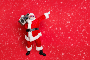 Wall Mural - full body photo of funny cute santa claus with sound boom disco box dancing wearing style eyeglasses