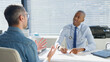 © Monkey Business - Mature Male Patient Sitting At Desk Having Consultation With Doctor In Office