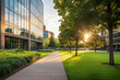 © Pics_With_Love - Sunlit office building with glass windows, green lawn, and tree-lined walkway, highlighting sustainable architecture, urban landscaping, and a peaceful corporate environment during sunset.