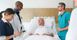 © Monkey Business - Medical Team On Rounds Visiting Senior Man Lying In Private Hospital Bed