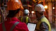 © Shutter2U - A woman engineer overseeing a building construction, discussing plans with a construction worker while checking her tablet with copy space