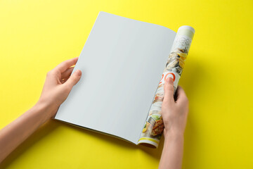 Poster - Woman reading magazine on yellow background, closeup. Mockup for design