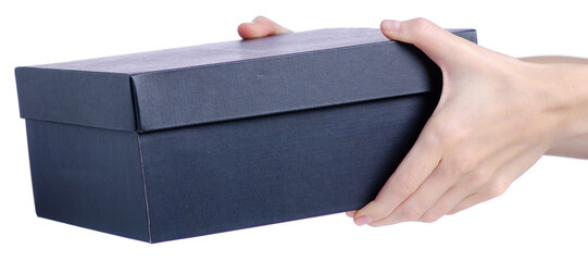 Black closed box, cardboard shoe in hand on a white background isolation