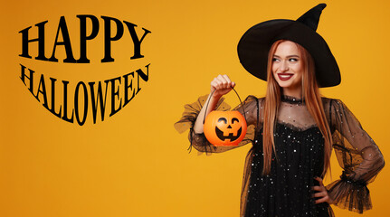 Wall Mural - Happy Halloween card. Woman dressed like witch holding pumpkin bucket on orange background