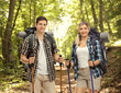 © Ljupco Smokovski - Young male and a female hikers posing with hiking equipment