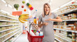 © Ljupco Smokovski - Woman holding a shopping basket with products falling inside