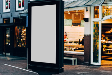 Wall Mural - Clear Billboard on city street with blank copy space screen for advertising or promotional poster content, empty mock up Lightbox for information in Amsterdam, blank display outdoors in urban area