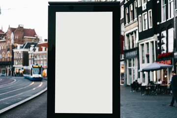 Wall Mural - Clear Billboard on city street with blank copy space screen for advertising or promotional poster content, empty mock up Lightbox for information, blank display outdoors in urban area