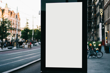 Wall Mural - Clear Billboard on city street with blank copy space screen for advertising or promotional poster content, empty mock up Lightbox for information, blank display outdoors in urban area