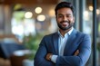 © Visual Odyssey - Happy indian business man in suit in modern office, Generative AI