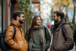© Visual Odyssey - Office colleagues talking outdoors near the office building, discussing new project, holding clipboard and laptop, Generative AI