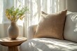 © Lucky_jl - A cozy living room scene featuring a neutral pillow, vase, and natural light filtering through soft curtains.