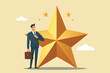 © Alya Hasna Fatimah - Receiving a star award, a businessman stands smiling happily
