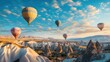 © wikkie - A scenic view of colorful hot air balloons floating over unique rock formations at sunrise.