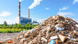 © Kowit - A pile of trash is next to a power plant