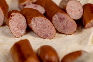 Wall Mural - fried pork sausages on a wheat tortilla