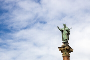 View of statue and column of San Domenico (Saint Dominic) at San Domenico Square in Bologna, Italy