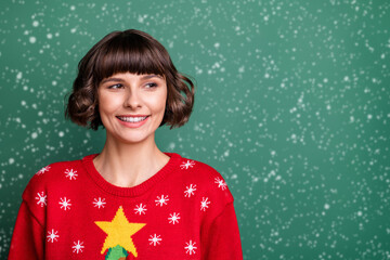 Wall Mural - Photo of dreamy pretty young woman dressed red pullover smiling looking empty space isolated green color background