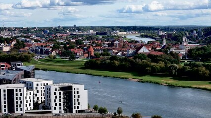 Wall Mural - Kaunas old town and new modern residential buildings, Lithuania. Panoramic aerial 4K video footage of Kaunas city center 