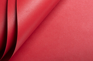 Aufkleber - Red scarlet paper with a rich, saturated tone and layered, geometric design. The minimalist, monochrome surface features elegant folds and bent lines, creating a luxurious backdrop