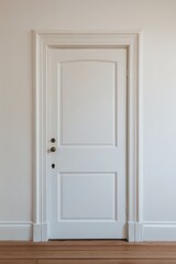 Wall Mural - A simple white door framed by classic molding in a minimalistic room with wooden flooring