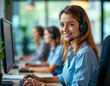 © Sheuli - A calm and attentive woman providing customer support through her headset, sitting at her organized workstation.