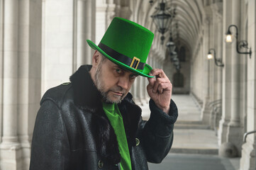 Man in green leprechaun hat. Man in green top hat for St. Patrick's Day themed content and celebrations.