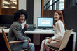 © zinkevych - Young man and young woman working together on the project in the office