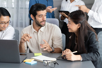 Group of diverse office worker employee working together on strategic business marketing planning in corporate office room. Positive teamwork in business workplace concept. Prudent