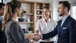 © Rgfx - Group, business people and shaking hands for welcome, introduction or meeting in office. Handshake, smile and team with deal for collaboration, agreement or thank you for b2b partnership opportunity