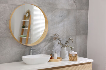 Wall Mural - Bath accessories, eucalyptus branches, sink and mirror in bathroom