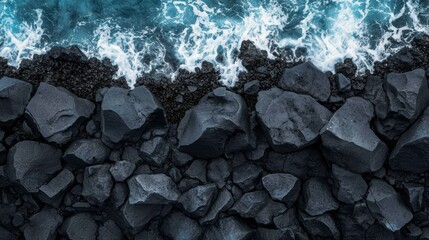 This drone shot shows the south coast of Tenerife with an Atlantic Ocean beating against a rocky cliff wall, blue rough sea with big waves and foam crashing against the rock walls.