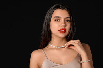 Poster - Beautiful young woman with red lips on black background