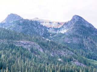 Snow covered mountains landscape nature forest snow sky peak tree view clouds summer winter. Snow covered mountains trees travel rock rocky valley green high cloud scenic.