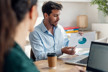 Canvas Print - Smart business people working together with laptop while talking in the coworking place