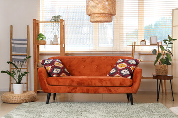 Sticker - Interior of living room with wooden ladder, red sofa and shelf units