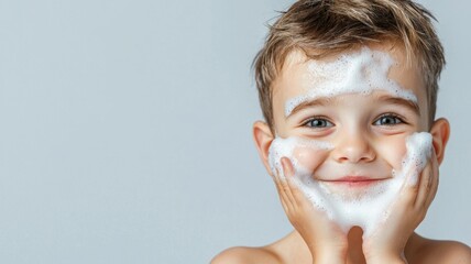 Canvas Print - A young boy is smiling while washing his face with soap