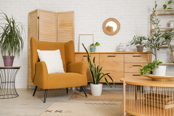 Wall Mural - Interior of living room with mirror, drawers and armchair