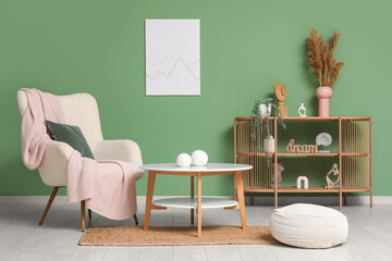 Wall Mural - Beautiful living room with white armchair, pouf and coffee table