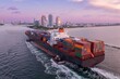 © Zenstratus - Container ship coming into the the port in Miami, via the channel in South Pointe, Miami, Florida, United States.