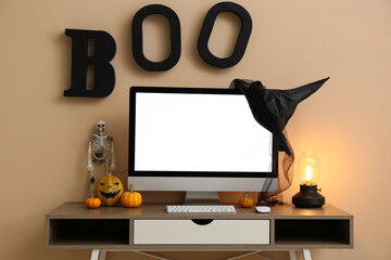 Sticker - Workplace with modern computer in comfortable office interior decorated for Halloween celebration