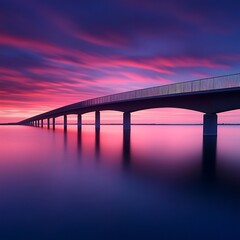 Wall Mural - Elegant architecture of bridge silhouetted against vibrant sunset sky picture