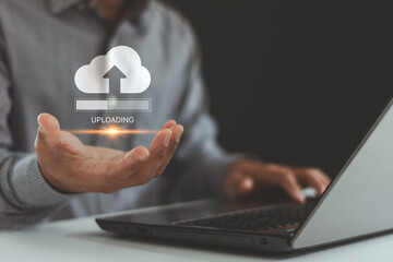 Fototapete - Upload processing data concept. Uploading data to cloud storage. The person using a laptop with an uploading bar on virtual screen for uploading files. Big data with file data transfer technology.